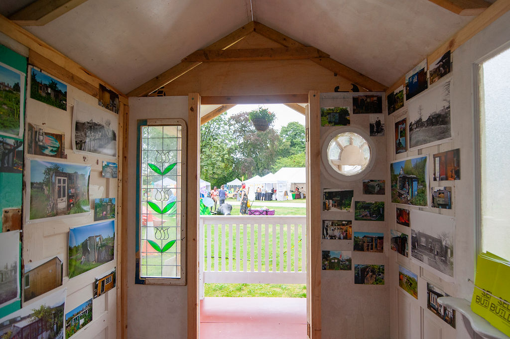 inside a shed full of paintings. Grandad's Island at Walthamstow Garden Party 2019